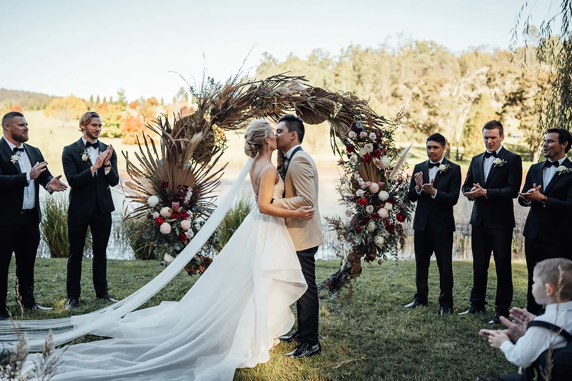 Bride and groom kissing at their Central Coast ceremony